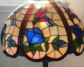Art Nouveau style floor lamp with stained glass "Hummingbird" shade.