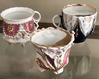 Antique hand-painted porcelain tea and mustache cups