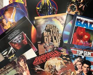 Vintage movie laser disks in original jackets.