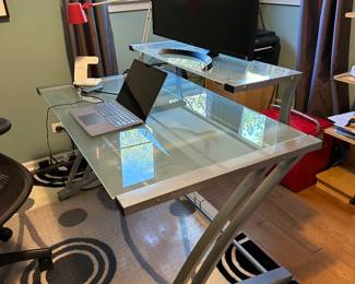 Desk with attached monitor platform. 