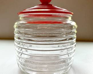 Small vintage jar with red top 