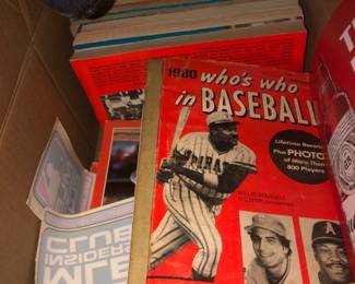 Several baseball books, stickers, 