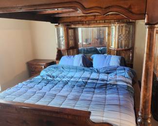 Solid wood California King mirrored canopy bed.