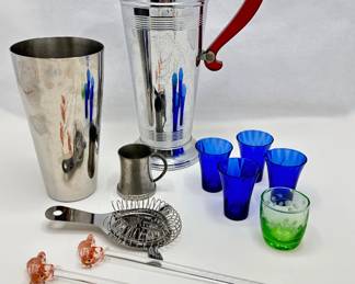 Vintage Art Deco Cocktail Shaker With Bakelite Handle, Shot Glasses, Elephant Swizzle Sticks & More
Lot #: 49