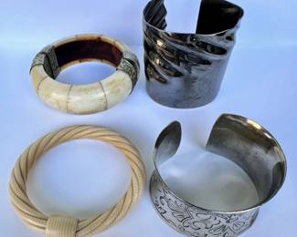 4 Bracelets Including Bone & 2 Metal Cuffs
Lot #: 134