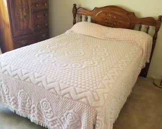 Double bed with painted headboard. Bedspread has been sold