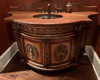 60" wide marble vanity with copper sink.