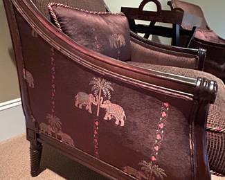 upholstered side arm chairs with elephant motifs by Clayton Marcus