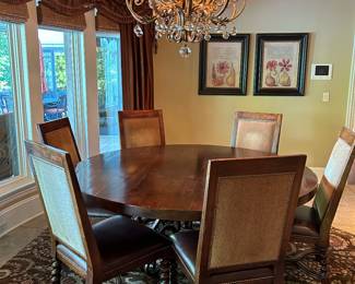 6' round dining table with 6 chairs by Lorts Furniture. Chandelier by John Richard