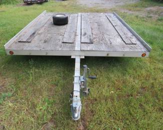 Lot 17: Spartan 10' x 8' tilt snowmobile trailer with a permanent license AADA 616  but no title.  2" hitch, spare tire and jack