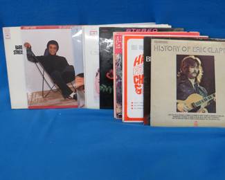 12 albums including Clapton, Bill Cosby, Kenny Rogers, and more
Lot 31: 12 albums including Clapton, Bill Cosby, Kenny Rogers, and more