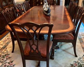 Heritage furniture by Heirloom,  Table with 2 leaves, 12 chairs with pads.