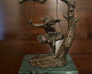 Bronze angel on a swing