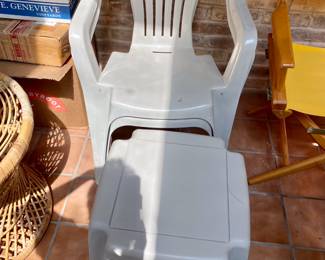 two plastic chairs with square side table 