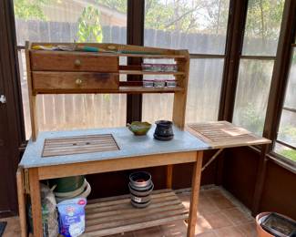 wonderful potting table  with fold out sides , galvanized work area 