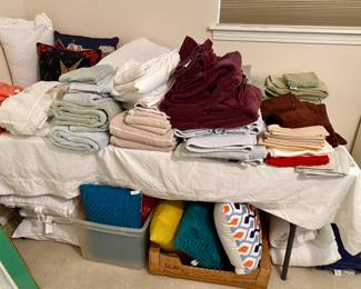 Many nice towel sets, pillows
