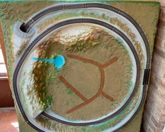 molded train track with tunnel and mountain