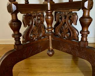 lovely antique marble top table with intricate carvings on the legs 