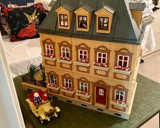 charming doll house full of furniture and other goodies, the front view 