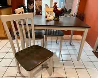 Nice farmhouse table along with four chairs