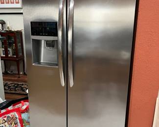Beautiful like new stainless steel refrigerator with ice and water in the door