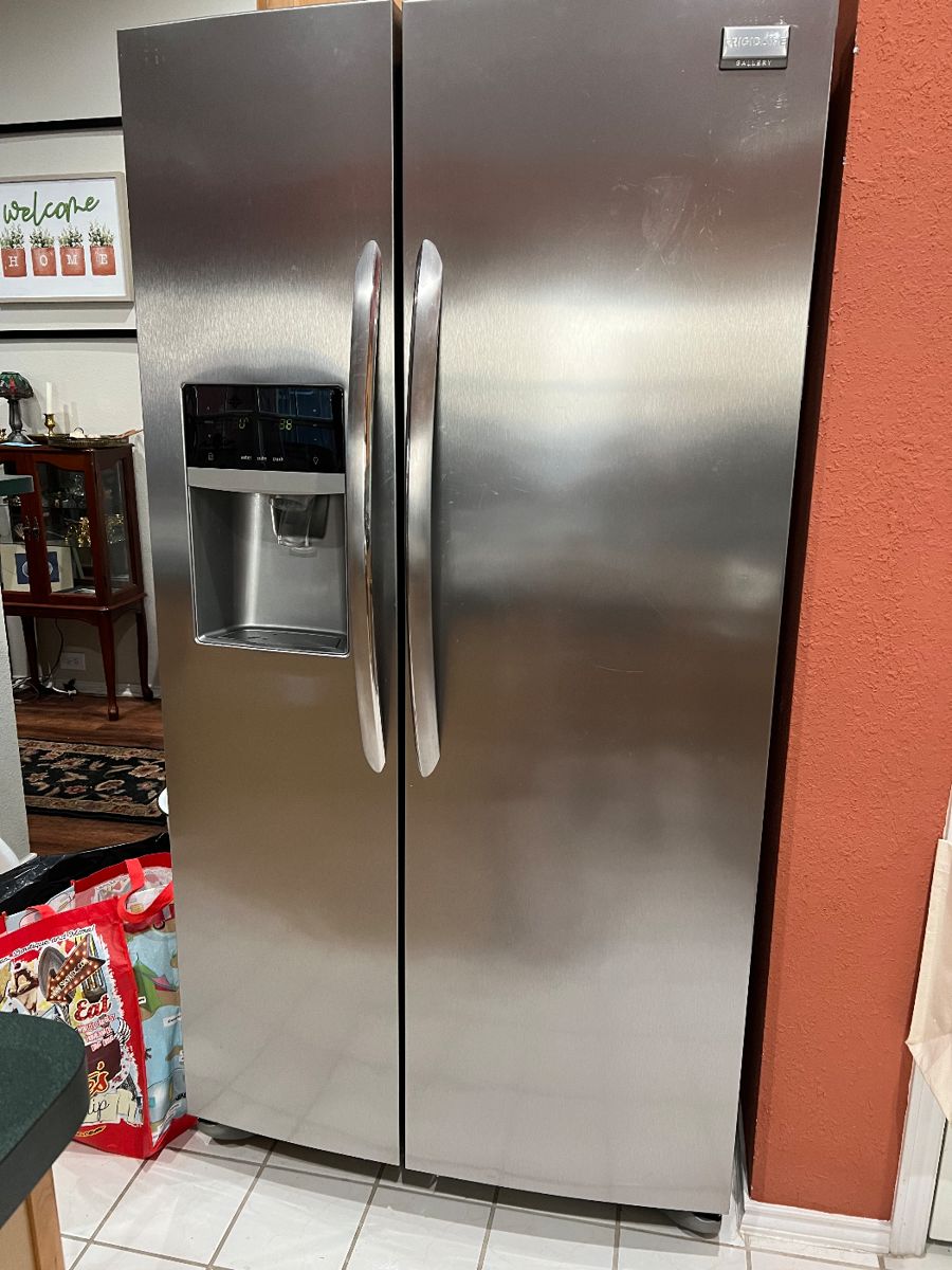 Beautiful like new stainless steel refrigerator with ice and water in the door