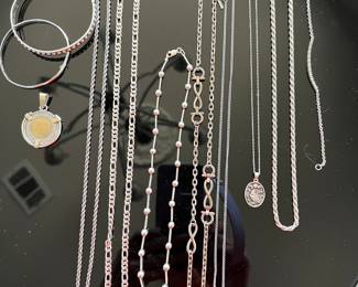 Lots of nice sterling, silver necklaces, bracelets, and charms