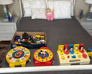 Bed frame with mattress, vintage toys, truck and car toys
