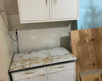 Enamel topped cabinet and metal wall cabinet
