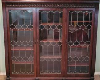 Large leaded glass vintage 3 door bookcase. Approximately 5 ft. Tall