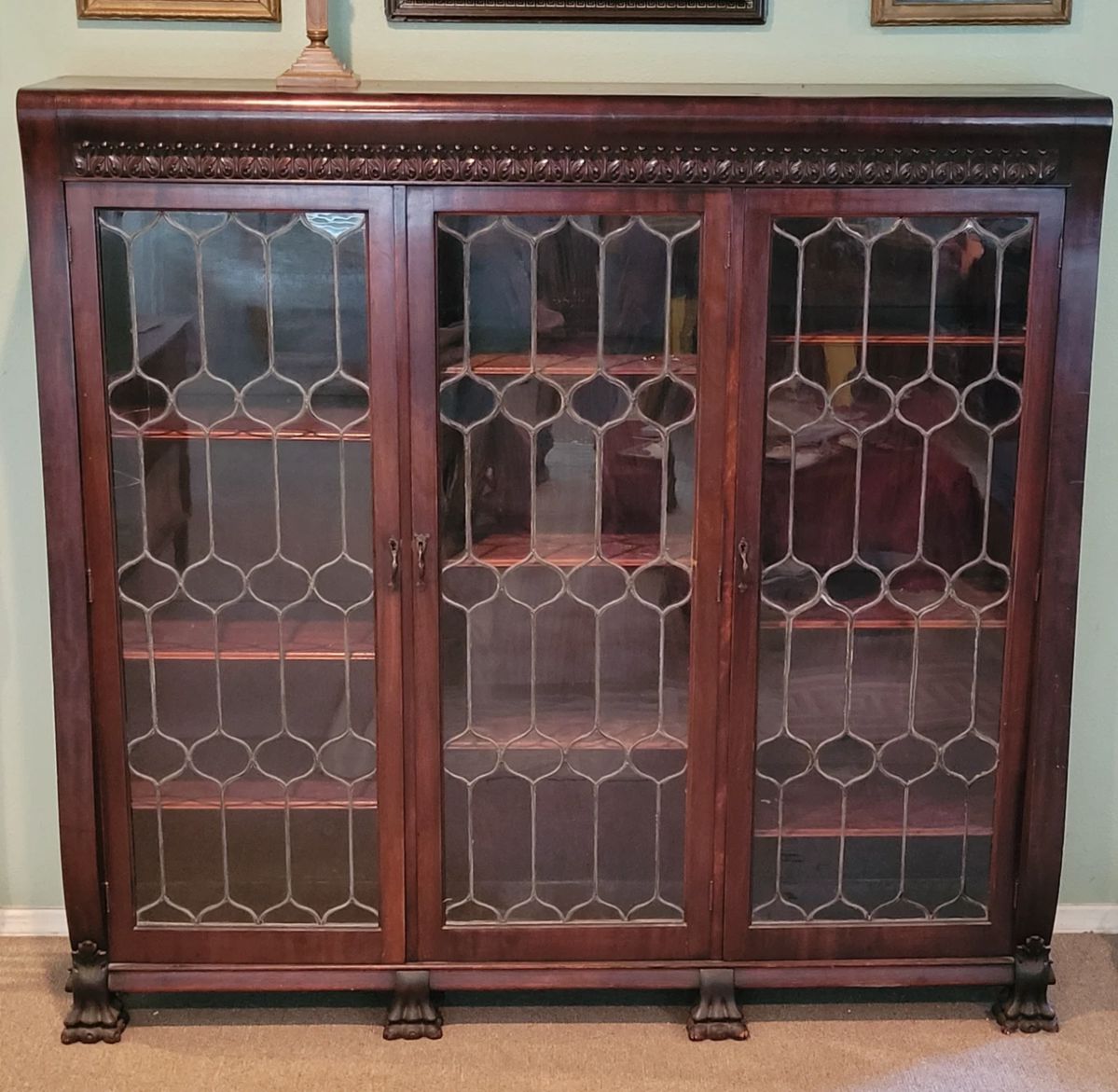Large leaded glass vintage 3 door bookcase. Approximately 5 ft. Tall