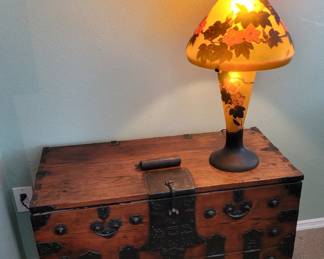 Antique trunk with reproduction Galle art glass lamp
