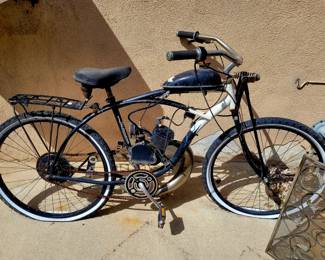 Old Schwinn beach cruiser with strap on engine