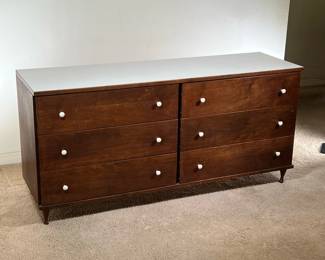 MID CENTURY DOUBLE DRESSER | Sleek dark-wood dresser, with two banks of three drawers, six drawers total. Topped with white laminate and white knobs. -  l. 59 x w. 18 x h. 28 in