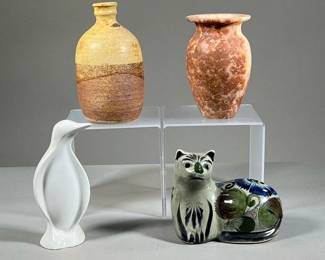 MIXED POTTERY & CERAMICS | A set of mixed pottery and ceramics including a hand-painted cat figurine, a white porcelain penguin figurine, a stone vase, and a ceramic bud vase. - h. 6.5 x dia. 3.5 in (largest)