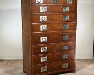BAKER FURNITURE TALL CHEST | Tall dresser in dark wood with eleven drawers. Two-piece construction; can be separated into two separate chests of drawers. Chinese style with nickel pulls. Made for Baker Furniture. - l. 36 x w. 19 x h. 57 in