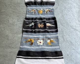 FLAT WOVEN MEXICAN MAT | Woven fabric in stripes of black, white, and blue, and decorated with decorated with birds and flowers in white and yellow. -  l. 54.5 x w. 26 in