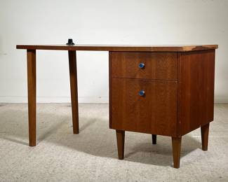 MID CENTURY WRITING DESK | Slender mid-century wooden writing desk with two drawers on the right-hand side featuring blue enameled metal pulls. - l. 48 x w. 24 x h. 28 in