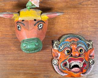 (2PC) PAIR OF FULL COLOR WOOD CARVED MASKS | Two handmade masks, including full-color dragon mask with gilt accents and full-color cow mask with rose on top. - l. 14.5 x w. 3.5 x h. 10 in