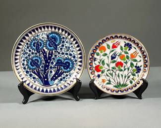(2PC) COLORFUL HAND MADE GILT PLATES | Includes colorful floral plate with gilt accents and border and a similarly decorated blue plate. Stamped on back “Apollon Keramik Archangelos Rodos.” - dia. 8.5 in
