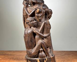 LARGE AFRICAN CARVED SCULPTURE | African wooden carving. Depicts large family or group of people embracing. - l. 6.5 x w. 5.5 x h. 15 in