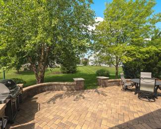 Patio with Weber natural Gas Grill and Tropitone Patio Dining Table and 4 Rocker Chairs