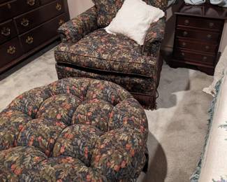 UPHOLSTERED CHAIR and MATCHING ROUND OTTOMAN
