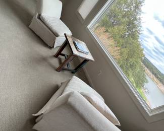 Master sitting area with 2 chairs and table