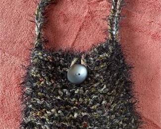 Lot 249   4 Bid(s)
Hand knit bag, with button closure
