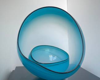 Chihuly Blue Sky Basket Set, sitting on its vitrine base. 