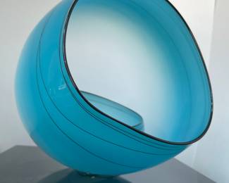 Chihuly Blue Sky Basket Set, sitting on its vitrine base. 