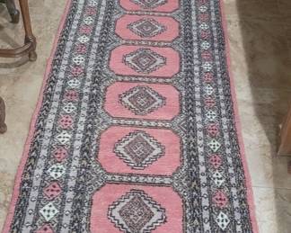 Hand knotted wool rug.