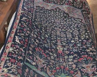 Tree of life hand knotted wool rug.