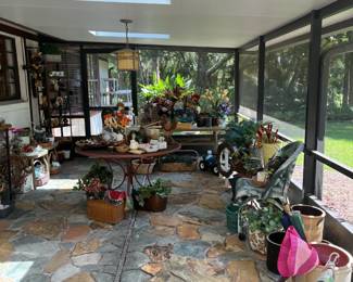 "The Garden Shop", live and artificial plants, plant pots and baskets, wicker furniture, garden decor, decorative rocks and seashells, garden flags, shelving and tables, and more! Everything shown is available for purchase.
